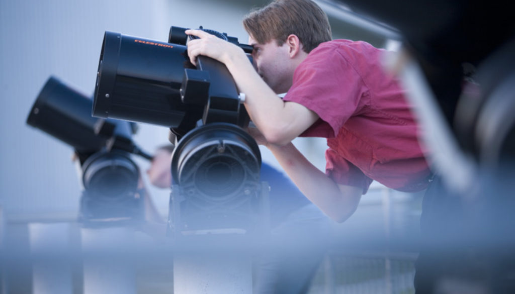 Student using telescope