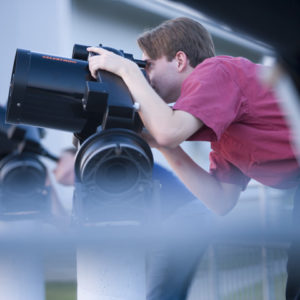 Student using telescope