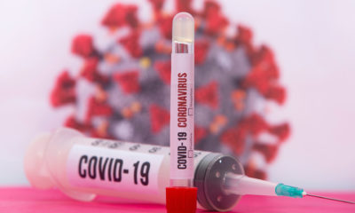 A needle shot labeled with COVID-19
