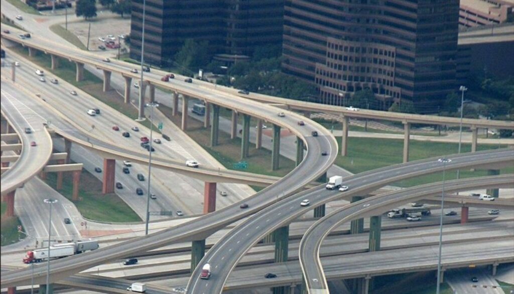 Overhead image of traffic on multiple overhead bridges and underpasses.