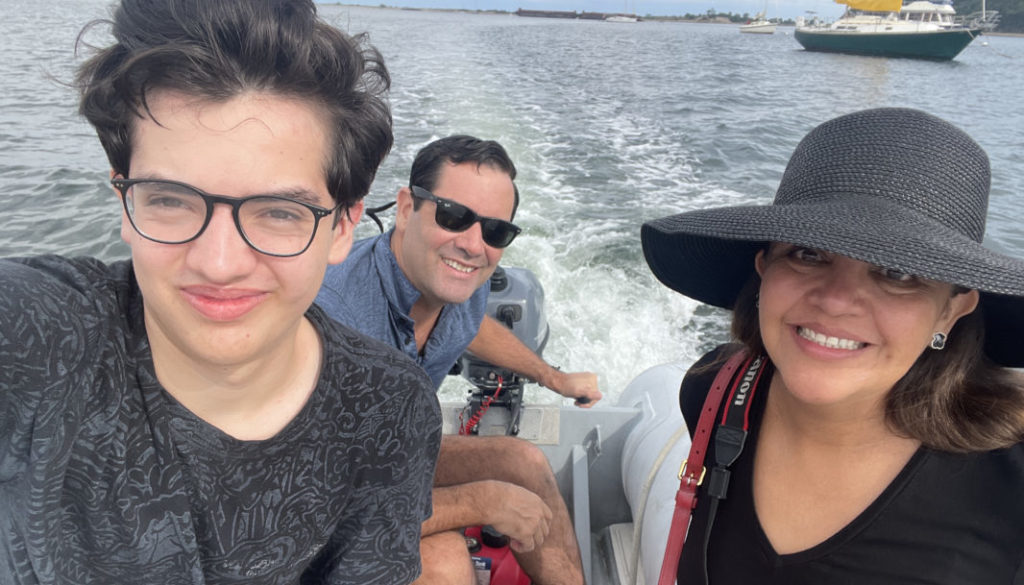 Brett Graham, his wife, Monica, and son, Ian, riding a boat