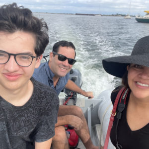 Brett Graham, his wife, Monica, and son, Ian, riding a boat